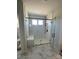 Modern shower boasts white subway tile, bench, glass enclosure, and black fixtures at 3240 Mcharney Dr # 36, Harrisburg, NC 28075