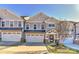 Modern 2-story townhome with gray siding, attached garage, and landscaped lawn at 373 Battery Cir, Clover, SC 29710