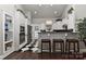 Well-equipped kitchen with white cabinets, black countertops and breakfast bar at 373 Battery Cir, Clover, SC 29710