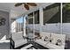 Relaxing screened porch with comfortable seating and ceiling fan at 373 Battery Cir, Clover, SC 29710