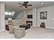 Bright sitting area with a sofa, armchairs, and a ceiling fan at 373 Battery Cir, Clover, SC 29710