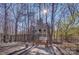 Landscaped backyard with seating area at 4010 Soleado Dr, Matthews, NC 28104