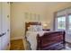 Charming bedroom with wood flooring and a large window at 4010 Soleado Dr, Matthews, NC 28104