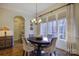 Bright dining room with hardwood floors and large windows at 4010 Soleado Dr, Matthews, NC 28104