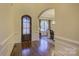 Bright and spacious entryway with hardwood floors and a view of the dining area at 4010 Soleado Dr, Matthews, NC 28104