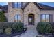 Elegant front entrance with stone detailing and a charming walkway at 4010 Soleado Dr, Matthews, NC 28104