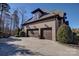 Two-car garage with driveway and landscaping at 4010 Soleado Dr, Matthews, NC 28104