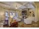 Gathering room with stone fireplace and coffered ceiling at 4010 Soleado Dr, Matthews, NC 28104