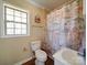 Bathroom with shower/tub combo, single sink vanity, and ocean-themed decor at 44743 Fish Camp Rd, New London, NC 28127