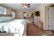 Main bedroom with ceiling fan, dresser, and access to bathroom at 44743 Fish Camp Rd, New London, NC 28127