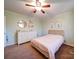 Bright bedroom with a double bed and dresser at 44743 Fish Camp Rd, New London, NC 28127