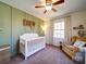 Bedroom with crib and rocking chair at 44743 Fish Camp Rd, New London, NC 28127