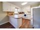 White kitchen with ample counter space and appliances at 44743 Fish Camp Rd, New London, NC 28127