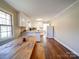 Kitchen with white cabinets, wood table, and an island at 44743 Fish Camp Rd, New London, NC 28127