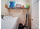 Laundry room with washer, dryer, and shelving at 44743 Fish Camp Rd, New London, NC 28127