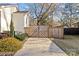 Modern wooden gate leading to backyard at 4526 Wedgewood Dr, Charlotte, NC 28210