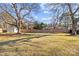 Spacious backyard with storage shed and wooden fence at 4526 Wedgewood Dr, Charlotte, NC 28210