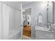 Modern bathroom with subway tile shower and white vanity at 4526 Wedgewood Dr, Charlotte, NC 28210