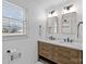 Modern bathroom with double vanity and a walk-in shower at 4526 Wedgewood Dr, Charlotte, NC 28210