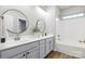 Modern bathroom with double vanity and soaking tub at 4827 Eaves Ln, Charlotte, NC 28215