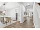 Bright dining room with hardwood floors and modern light fixture at 4827 Eaves Ln, Charlotte, NC 28215