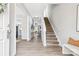 Bright entryway with hardwood floors and staircase at 4827 Eaves Ln, Charlotte, NC 28215