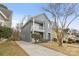 Two-story gray house with driveway and surrounding houses visible at 4827 Eaves Ln, Charlotte, NC 28215