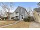 Two-story gray house with a balcony and landscaping at 4827 Eaves Ln, Charlotte, NC 28215