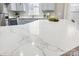 Modern kitchen features a large quartz countertop at 4827 Eaves Ln, Charlotte, NC 28215