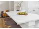 Kitchen island with a marble countertop and seating at 4827 Eaves Ln, Charlotte, NC 28215