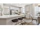 Modern kitchen with white cabinets, island, and stainless steel appliances at 4827 Eaves Ln, Charlotte, NC 28215