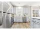 Modern kitchen with stainless steel appliances and white cabinets at 4827 Eaves Ln, Charlotte, NC 28215