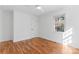 A light-filled bedroom showcases hardwood floors, a window view, and crisp white trim at 5113 Grice Ct, Charlotte, NC 28210