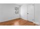 Bright bedroom featuring hardwood floors, one window, and a single closet door at 5113 Grice Ct, Charlotte, NC 28210