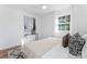 Cozy bedroom with soft bedding, a patterned rug, and natural light at 5113 Grice Ct, Charlotte, NC 28210