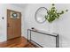 Bright and airy entryway with wood floors and modern console table at 5113 Grice Ct, Charlotte, NC 28210