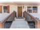 Close-up of home featuring white brick stairs and a decorative wreath on a wooden door at 5113 Grice Ct, Charlotte, NC 28210