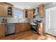 Updated kitchen, featuring stainless steel appliances and wood cabinets at 5113 Grice Ct, Charlotte, NC 28210