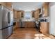 Modern kitchen with stainless steel appliances and light wood cabinets at 5113 Grice Ct, Charlotte, NC 28210