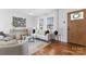 Bright living room with hardwood floors, neutral walls, modern furnishings, and natural light at 5113 Grice Ct, Charlotte, NC 28210