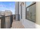 Private balcony with composite decking and black metal railings, overlooking the community at 539 W Tremont Ave, Charlotte, NC 28203