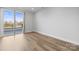 Bedroom with private balcony and hardwood floor at 539 W Tremont Ave, Charlotte, NC 28203