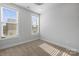 Well-lit bedroom with neutral walls and carpet at 539 W Tremont Ave, Charlotte, NC 28203