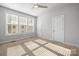 Bright bedroom with carpet, ceiling fan, and large windows at 539 W Tremont Ave, Charlotte, NC 28203