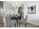 Dining room with hardwood floors, chandelier, and seating for four at 539 W Tremont Ave, Charlotte, NC 28203