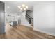 Open dining area with hardwood floors and view into the kitchen at 539 W Tremont Ave, Charlotte, NC 28203