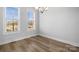 Bright dining room with hardwood floors and large windows at 539 W Tremont Ave, Charlotte, NC 28203