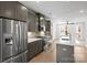 Modern kitchen featuring stainless steel appliances and an island with white countertop at 539 W Tremont Ave, Charlotte, NC 28203