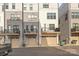 Rear view of townhouses, showcasing garages and balconies at 539 W Tremont Ave, Charlotte, NC 28203