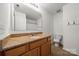 Bathroom with granite countertop and wood cabinets at 611 Cahill Ln, Fort Mill, SC 29715